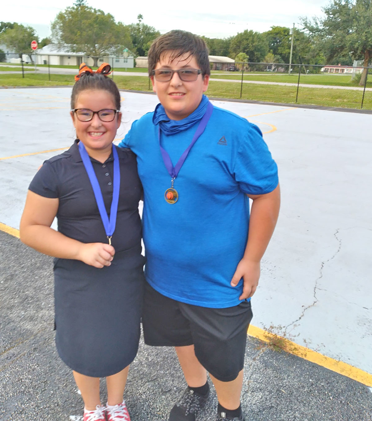 On the left is Rachel Gonzalez with her brother Daniel Gonzalez on the right. Both were first place winners at the Elks Hoop Shoot on Tuesday, Nov. 9.